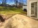 Private backyard with grassy area and patio at 257 Doughton Ln, Charlotte, NC 28217