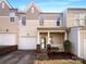 Two-story townhome with attached garage and front porch at 257 Doughton Ln, Charlotte, NC 28217