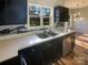 Updated kitchen boasts dark cabinetry, stainless steel appliances, and marble accents at 257 Doughton Ln, Charlotte, NC 28217