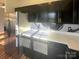 Stainless steel refrigerator and modern cabinetry in this updated kitchen at 257 Doughton Ln, Charlotte, NC 28217