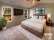 Virtually staged main bedroom with large windows and plush carpet at 257 Doughton Ln, Charlotte, NC 28217