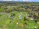 The aerial shot of the property shows wooded scenery and a community of homes at 2880 Harmony Rd, Rock Hill, SC 29730