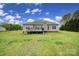Backyard view of home with a deck and green lawn at 2880 Harmony Rd, Rock Hill, SC 29730