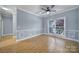 Bedroom boasting laminate flooring, soft blue walls, and ample natural light from a large window at 2880 Harmony Rd, Rock Hill, SC 29730