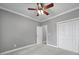A comfortable bedroom is displayed with a ceiling fan and double closets at 2880 Harmony Rd, Rock Hill, SC 29730