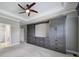 Bedroom features custom gray built-ins, fan, and tray ceiling at 2880 Harmony Rd, Rock Hill, SC 29730