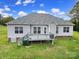 Back exterior of home with grey siding and a wooden deck at 2880 Harmony Rd, Rock Hill, SC 29730