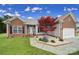 Charming single-Gathering home featuring a well-manicured lawn and a vibrant red maple tree at 2880 Harmony Rd, Rock Hill, SC 29730