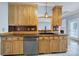 Close up on a kitchen area featuring wooden cabinets, sleek black appliances, and stylish countertops at 2880 Harmony Rd, Rock Hill, SC 29730