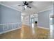 Open-concept living area featuring laminate flooring, a fireplace, and views into adjoining rooms at 2880 Harmony Rd, Rock Hill, SC 29730