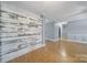 Open living room with laminate floors, decorative paneling and neutral color palette at 2880 Harmony Rd, Rock Hill, SC 29730