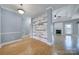Spacious living area featuring wood floors, a fireplace and decorative columned accents at 2880 Harmony Rd, Rock Hill, SC 29730
