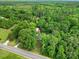 Aerial view of a secluded home nestled among a lush green forest at 2988 Great Falls Hwy, Lancaster, SC 29720