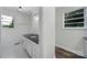 Bright bathroom featuring a vanity with a black countertop and white cabinets at 2988 Great Falls Hwy, Lancaster, SC 29720