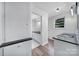 Well-lit bathroom with a black countertop, white cabinets, and a tiled floor at 2988 Great Falls Hwy, Lancaster, SC 29720