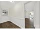 Bright entryway with white wainscoting and dark hardwood floors at 2988 Great Falls Hwy, Lancaster, SC 29720