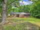 Charming brick ranch-style home with a well-maintained lawn and mature trees offering shade at 2988 Great Falls Hwy, Lancaster, SC 29720