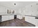 Renovated kitchen with white cabinets, new appliances, and dark floors at 2988 Great Falls Hwy, Lancaster, SC 29720