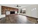 Living room with brick fireplace and hardwood floors at 2988 Great Falls Hwy, Lancaster, SC 29720