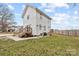 This home boasts a spacious backyard, complete with a cozy deck, ample green space, and a well-maintained fence at 305 Wingate Ct, Shelby, NC 28152
