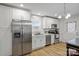 Bright kitchen featuring stainless steel appliances, white cabinetry and a bistro sign above the window at 305 Wingate Ct, Shelby, NC 28152