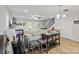 Open-concept living room featuring hardwood floors, an adjacent staircase, and modern lighting, perfect for entertaining or relaxing at 305 Wingate Ct, Shelby, NC 28152