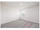 Simple bedroom with window and grey carpeting at 321 Brinkley Dr, Kings Mountain, NC 28086