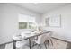 Bright dining room with table set for four and stylish wall art at 321 Brinkley Dr, Kings Mountain, NC 28086