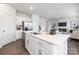 Bright and modern kitchen with stainless steel appliances, a spacious island, and a view into the living area at 321 Brinkley Dr, Kings Mountain, NC 28086