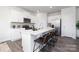 Modern kitchen with a large center island, stainless steel appliances, and barstool seating for casual dining at 321 Brinkley Dr, Kings Mountain, NC 28086