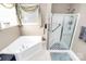 Bathroom with corner tub and shower stall at 3229 Sapphire Ln, Fort Mill, SC 29708