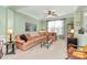Spacious living room featuring a corner sectional sofa and large windows at 3229 Sapphire Ln, Fort Mill, SC 29708
