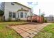 Spacious backyard featuring a brick patio and wooden deck, perfect for outdoor entertaining at 5707 Brandy Ridge Ln, Charlotte, NC 28269