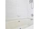Bright white bathtub with shower featuring a white tiled wall at 5707 Brandy Ridge Ln, Charlotte, NC 28269