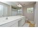 Bathroom featuring dual sinks, ample counter space, vanity, and natural light at 5707 Brandy Ridge Ln, Charlotte, NC 28269