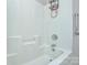Bright bathtub with a white surround and stainless steel fixtures at 5707 Brandy Ridge Ln, Charlotte, NC 28269