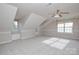 Large bonus room featuring unique architecture, lots of natural light and carpeted floors at 5707 Brandy Ridge Ln, Charlotte, NC 28269