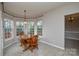 Dining area featuring lots of windows and a wooden dining table at 5707 Brandy Ridge Ln, Charlotte, NC 28269