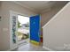 Bright foyer features tile flooring, a decorative front door window, and a staircase to the second level at 5707 Brandy Ridge Ln, Charlotte, NC 28269