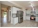 Updated kitchen featuring stainless steel appliances, white cabinets, and stylish backsplash at 5707 Brandy Ridge Ln, Charlotte, NC 28269