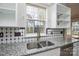 Kitchen sink area featuring stainless steel appliances and granite countertops at 5707 Brandy Ridge Ln, Charlotte, NC 28269