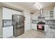 Stylish kitchen with stainless steel refrigerator, modern appliances, and tile backsplash at 5707 Brandy Ridge Ln, Charlotte, NC 28269