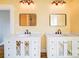 Stylish bathroom featuring dual sinks with marble counters, decorative vanities, and modern lighting at 613 S Mulberry St, Statesville, NC 28677