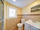 The bathroom has a window that gives natural light to the space, along with a shower at 613 S Mulberry St, Statesville, NC 28677