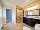Modern bathroom features marble tile in the walk-in shower and double vanity at 613 S Mulberry St, Statesville, NC 28677