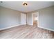 A bright bedroom with neutral walls and a large doorway that allows plenty of natural light at 613 S Mulberry St, Statesville, NC 28677