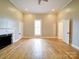 Bright bedroom featuring hardwood floors, neutral paint and a fireplace at 613 S Mulberry St, Statesville, NC 28677