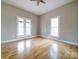 Bright bedroom with multiple windows and light wood floors at 613 S Mulberry St, Statesville, NC 28677