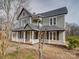 Charming two-story home featuring a welcoming front porch and classic architectural design at 613 S Mulberry St, Statesville, NC 28677