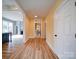 Bright hallway with wood floors connecting the entryway to the living space at 613 S Mulberry St, Statesville, NC 28677